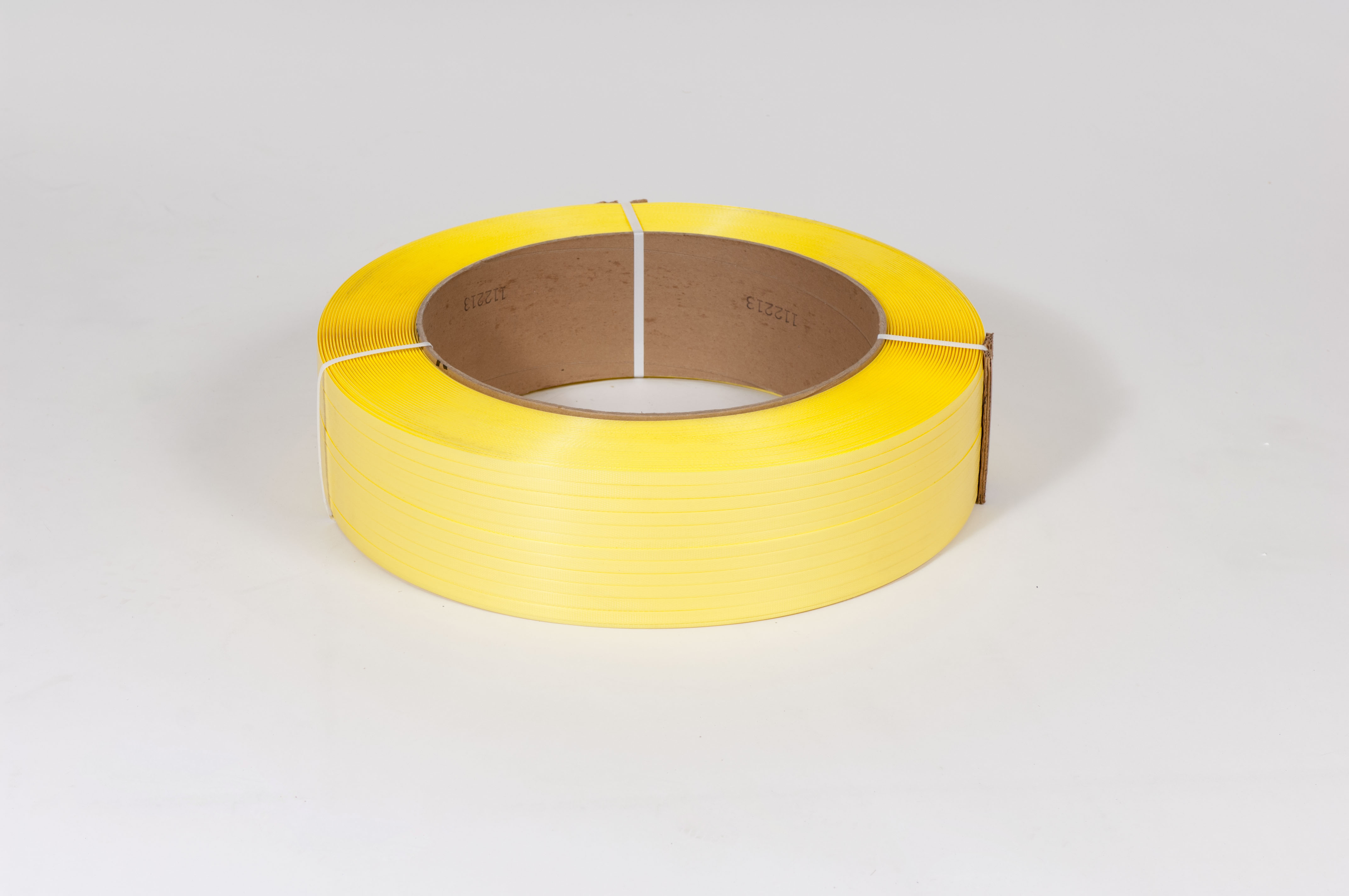 FINAL SALE: 1/2" x 7,200` .031 600# 16 x 6 Yellow Machine Grade Poly Strapping image